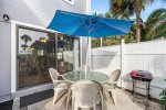 Patio with table, umbrella, and chairs 